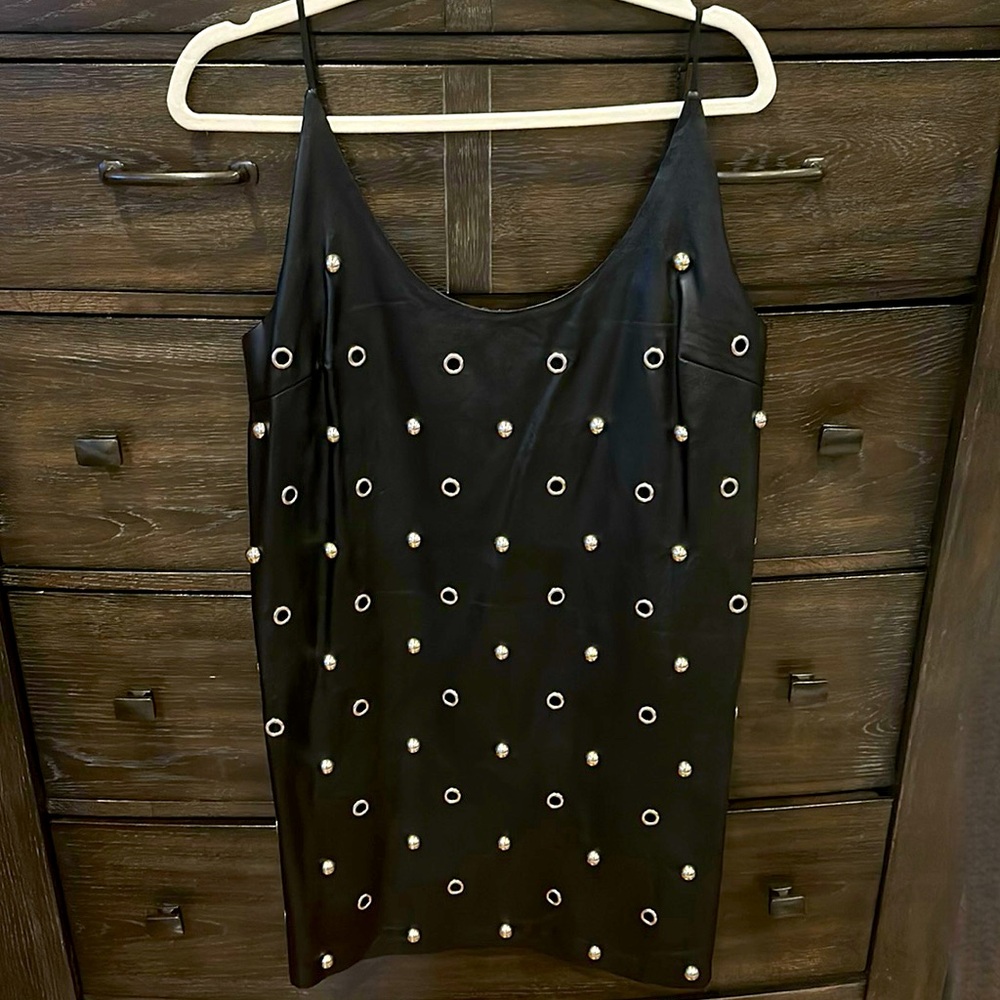 NWOT DO + BE faux leather dress never been worn with silver circle accents.